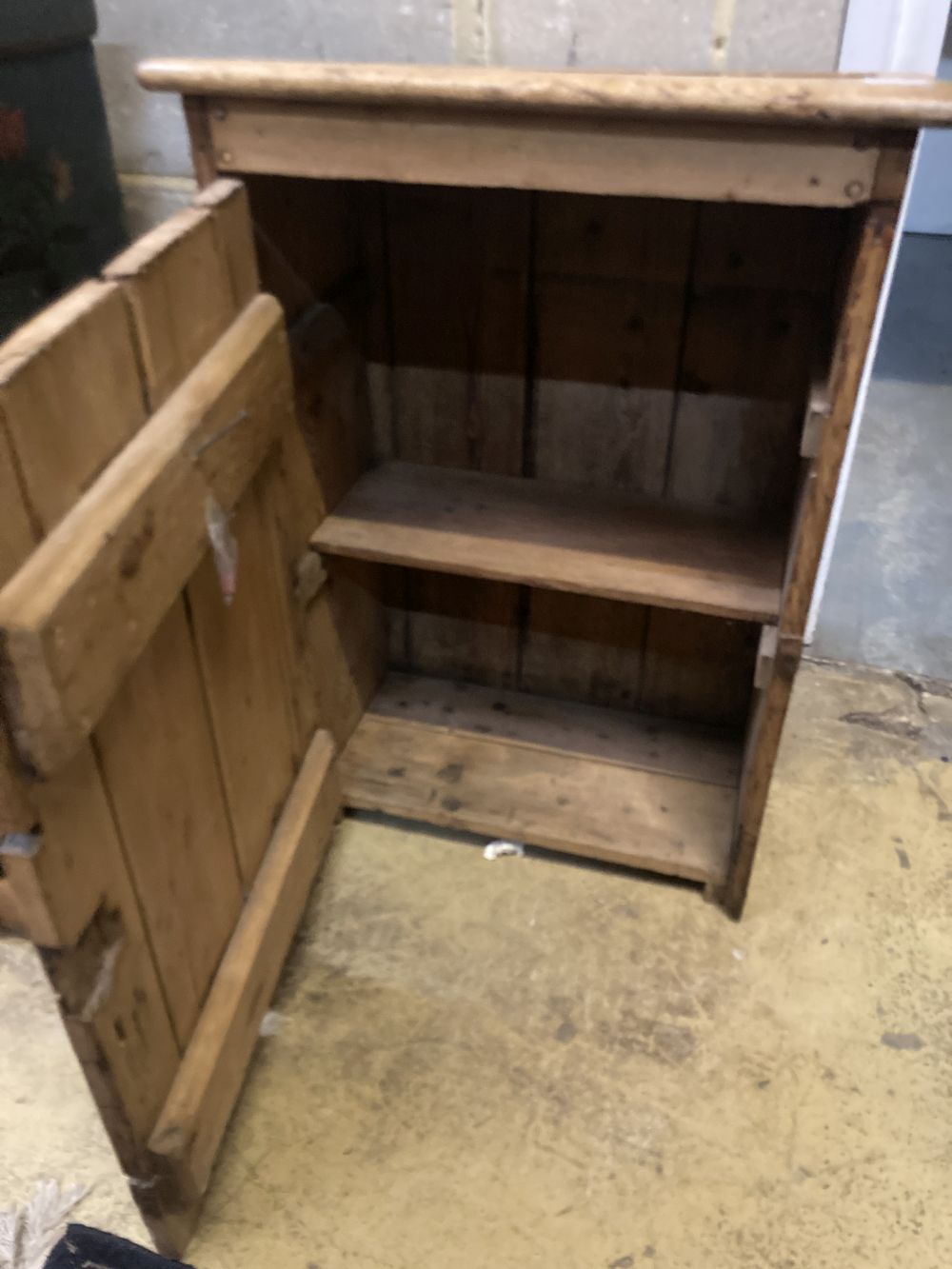 A 19th century pine wall cabinet, width 59cm depth 32cm height 84cm, together with a wirework rack